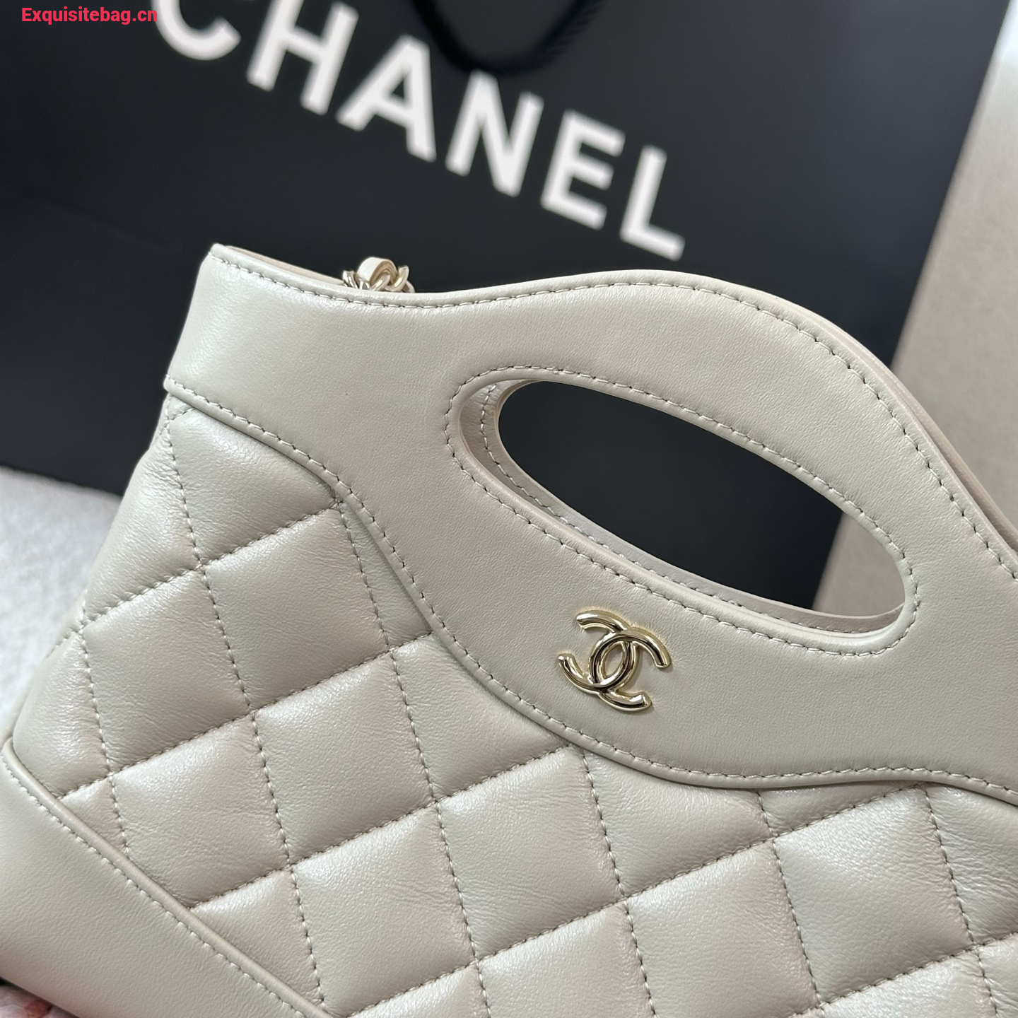 Chanel Beige quilted leather mini tote bag with chain shoulder strap